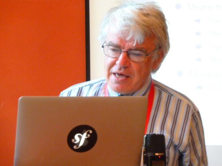 A participant presenting at a laptop