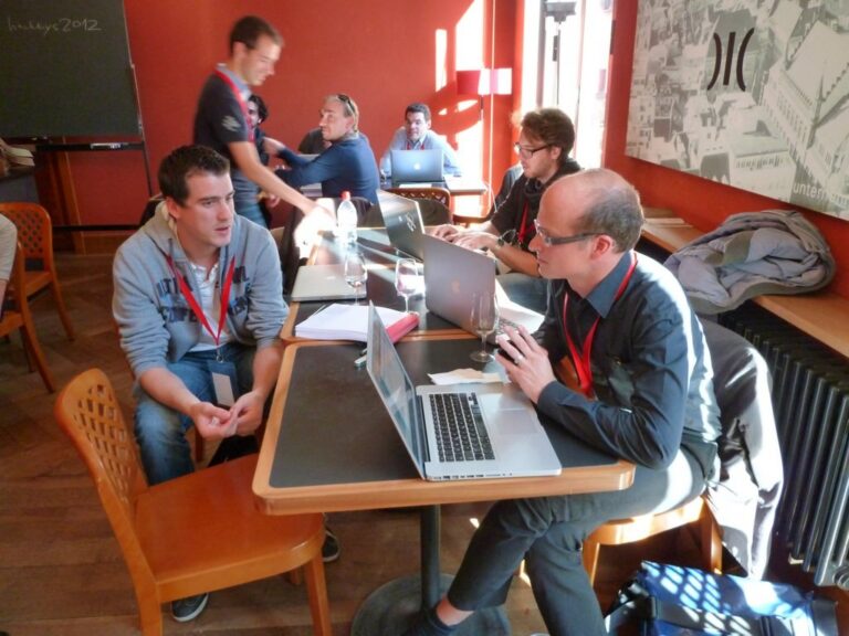 Participants working at laptops