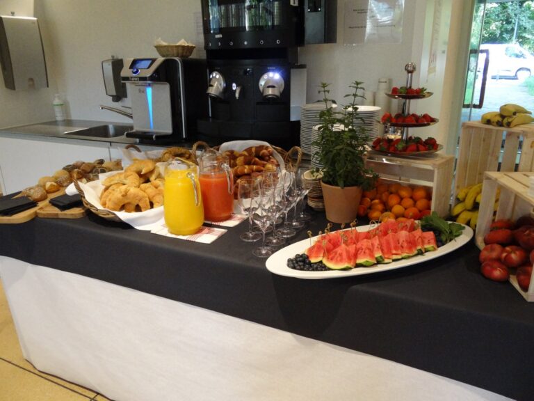 Breakfast buffet with croissants, juice and fruit