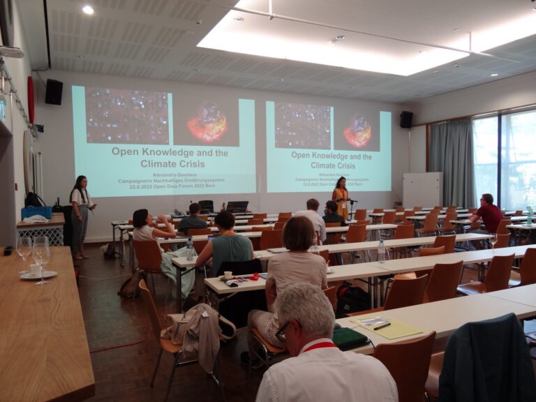 Main hall with the slide «Open Knowledge and the Climate Crisis»