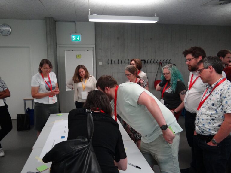 Participants talking in a seminar room