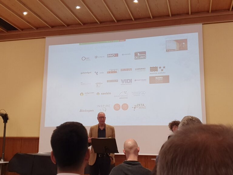 Friday morning: welcome in the auditorium, the partners on screen