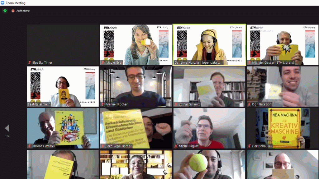 Des participant·e·s au hackathon montrent des objets jaunes à la caméra